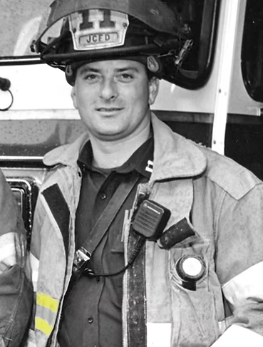 Photo of Captain Buscio in his New Jersey Firefighter Uniform